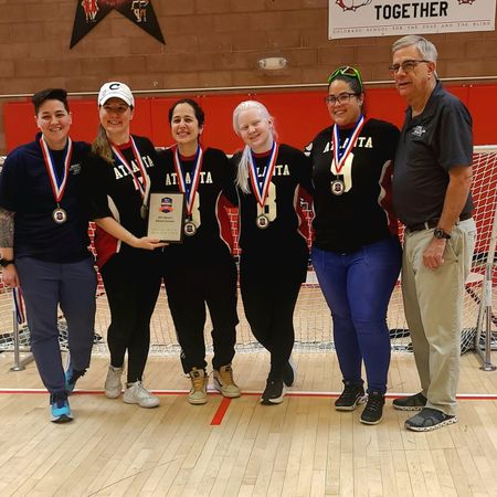 The Blazers pose with their medals and the 2025 Women's National Champion plaque