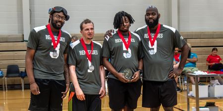 The Renegades goalball team poses with their medals and trophy at the 2025 Regionals