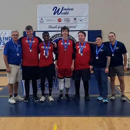 The Georgia boys goalball team poses with their 1st place medals at the Savannah tournament