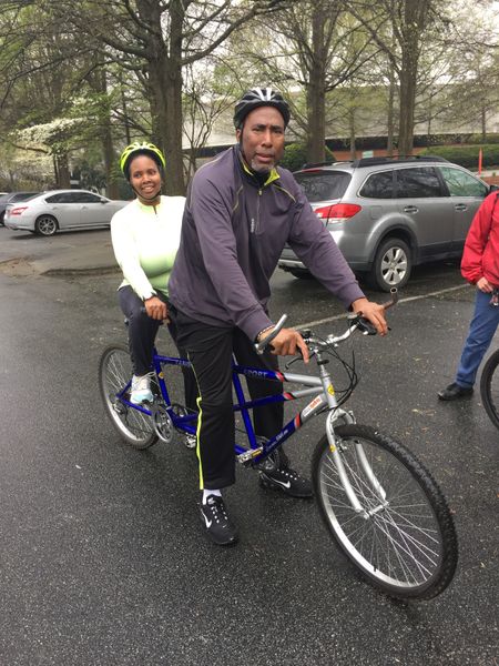 Two tandem cycling riders head out on a group ride